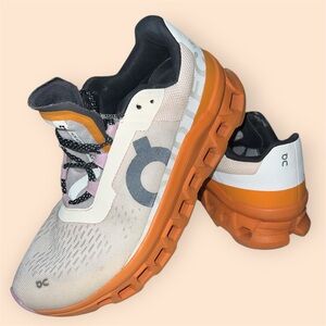 On Running Orange and White Sneakers